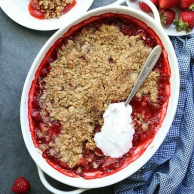 Healthy Gluten-Free Strawberry Crisp! This is an easy rustic free-form oat topping that becomes naturally moistened as it bakes into a buttery flavor. I like to use monk fruit sugar in the topping making it sugar-free. It is delectable served warm! #glutenfree #strawberry #crisp #strawberrycrisp #glutenfreestrawberrycrisp #healthy #sugarfree #dessert #sweets #treats #strawberry | Recipe at Delightful Mom Food