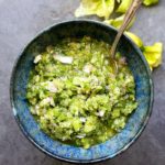 homemade tomatillo salsa served in a blue bowl