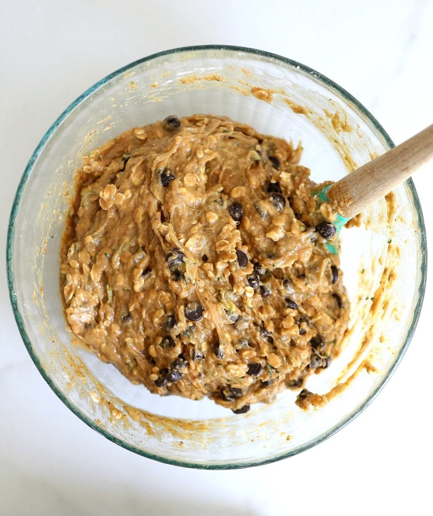 chocolate chip zucchini cookie dough batter in a bowl with a spatula