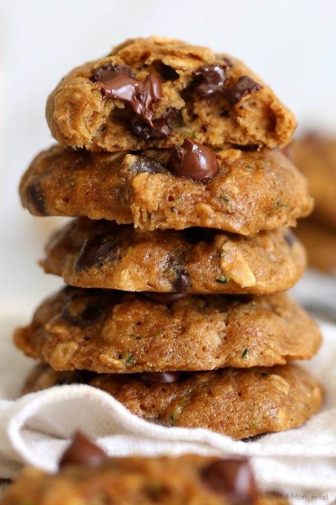 a stack of warm zucchini cookies made with oatmeal and melted chocolate chips