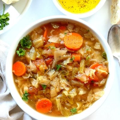 bowl of warm cabbage, carrots, parsley soup