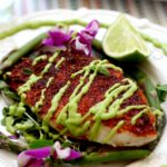 baked rockfish recipe with blackened seasoning and avocado fish taco sauce on top