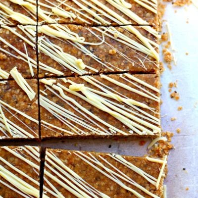 sliced homemade chewy granola bars recipe with melted white chocolate