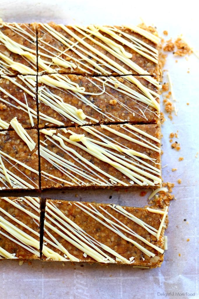 sliced homemade chewy granola bars recipe with melted white chocolate 