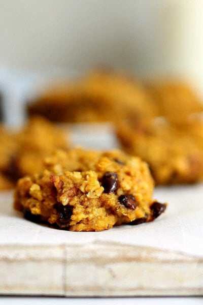 Pumpkin breakfast cookies on a wood board.