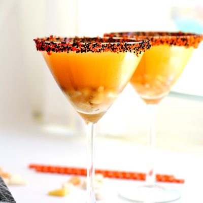 Candy corn martini recipe served in two martini glasses