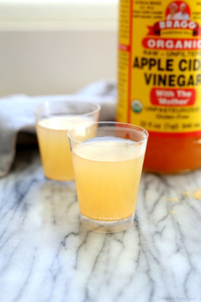 apple cider vinegar with lemon and honey served as shots