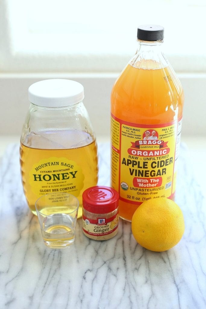 apple cider vinegar, honey, ginger, water, and lemon used for apple cider vinegar shots