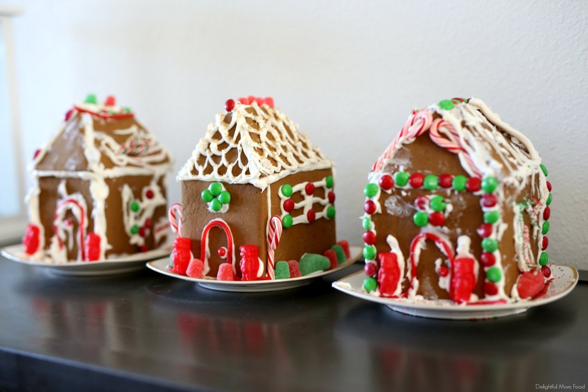 three decorated homemade gingerbread houses