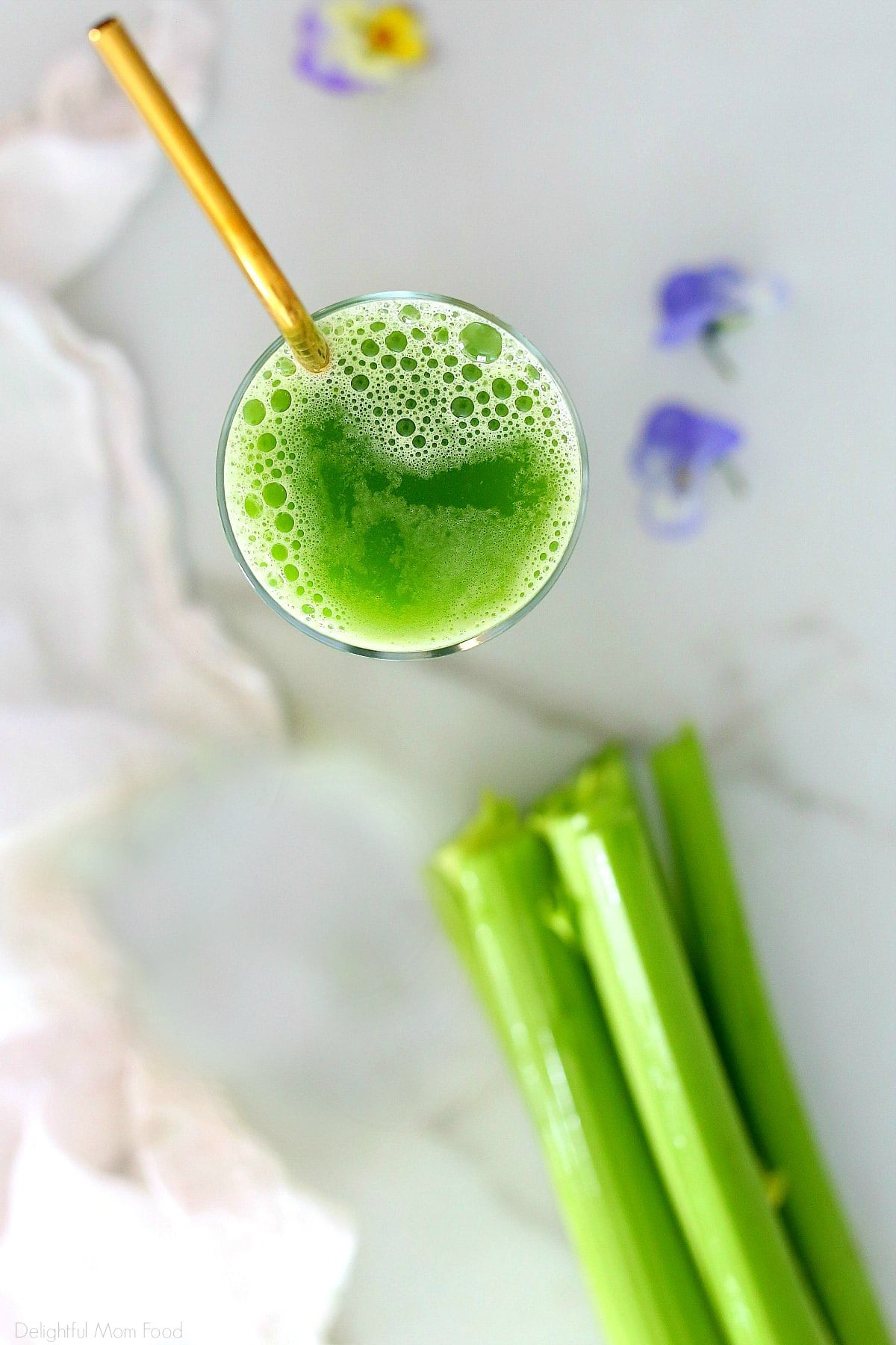 overview of celery juice weight loss recipe in a glass and fresh celery stalks next to it