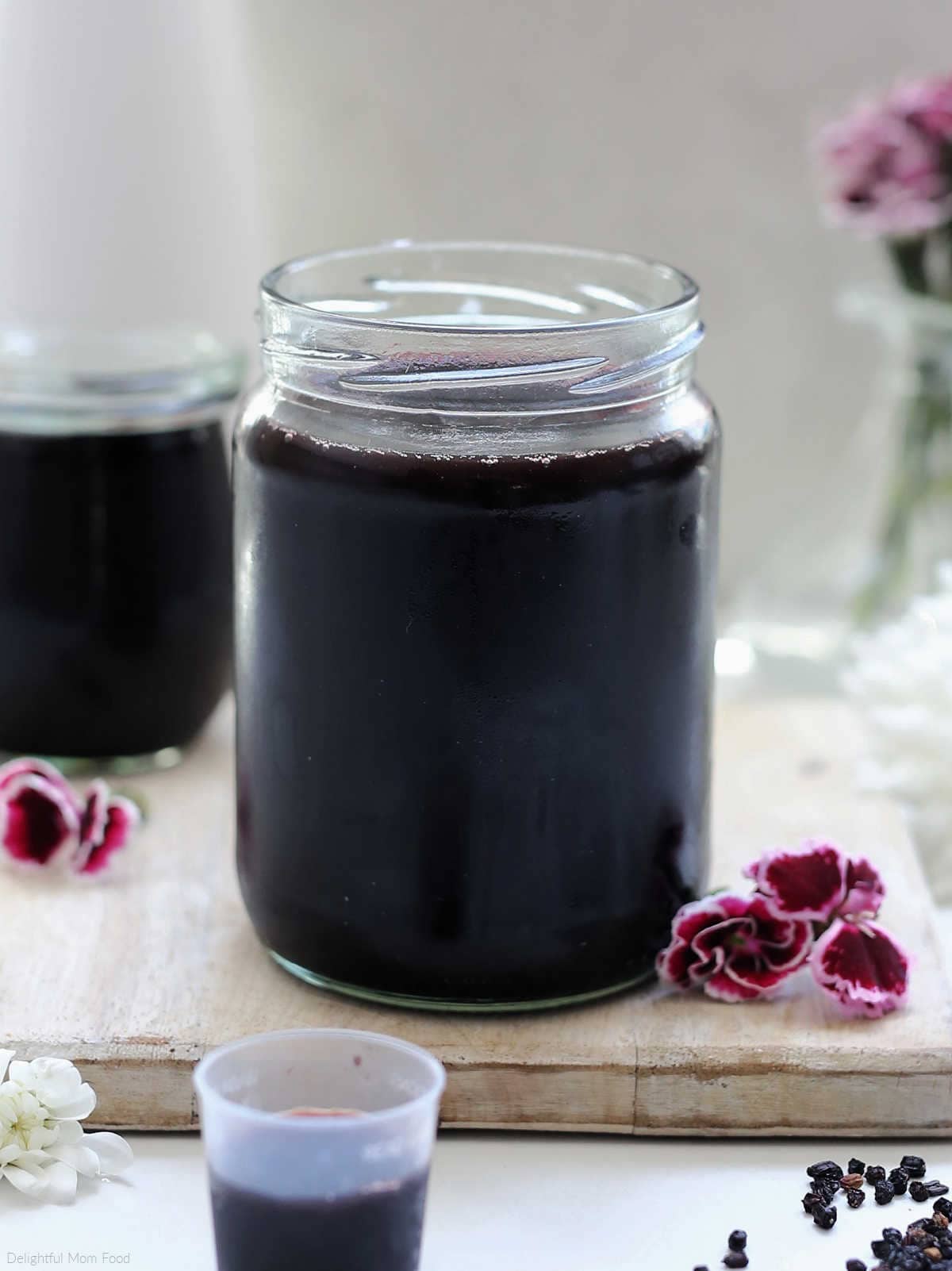 homemade elderberry syrup recipe in a glass jar