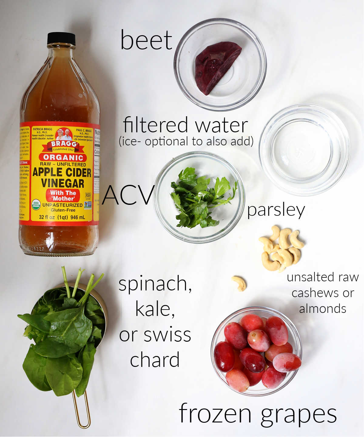 apple cider vinegar spinach grapes beets and all ingredients that go into an apple cider vinegar smoothie drink