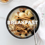 bowl of peanut butter oatmeal with raisins and banana slices