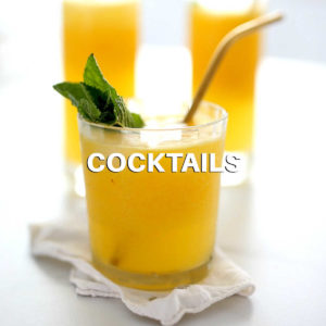 mango cocktail vodka drink on a cloth napkin
