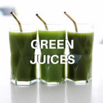homemade green juice in three glasses with gold straws