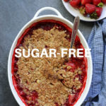 sugar free strawberry crisp in a baking dish with a spoon