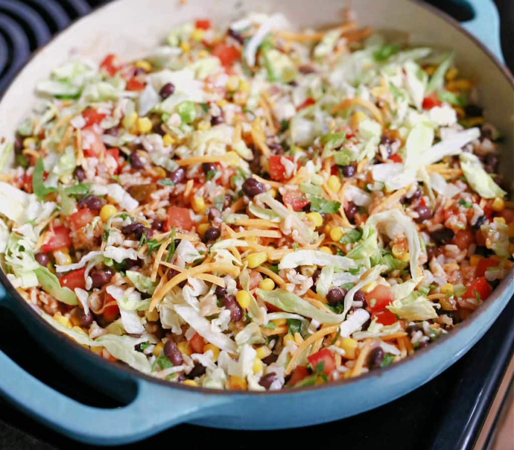 warmed black bean taco salad mixed in a sauté pan on the stove