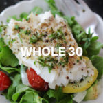 baked cod fish over salad greens