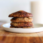 stack of AIP cookies and a glass of dairy-free milk
