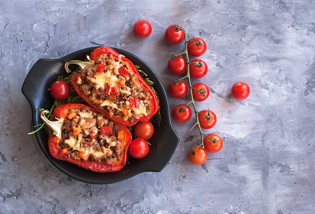 paprika on stuffed peppers with tomatoes on a table