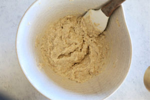 gluten free oatmeal muffin batter in a bowl with a spatula