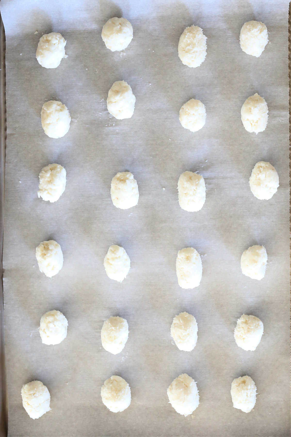 irish potato candy shaped like a potato on a baking sheet