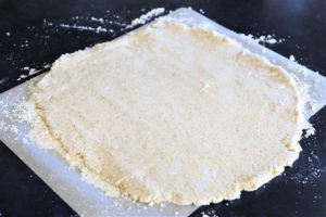 aip pizza dough rolled out for baking