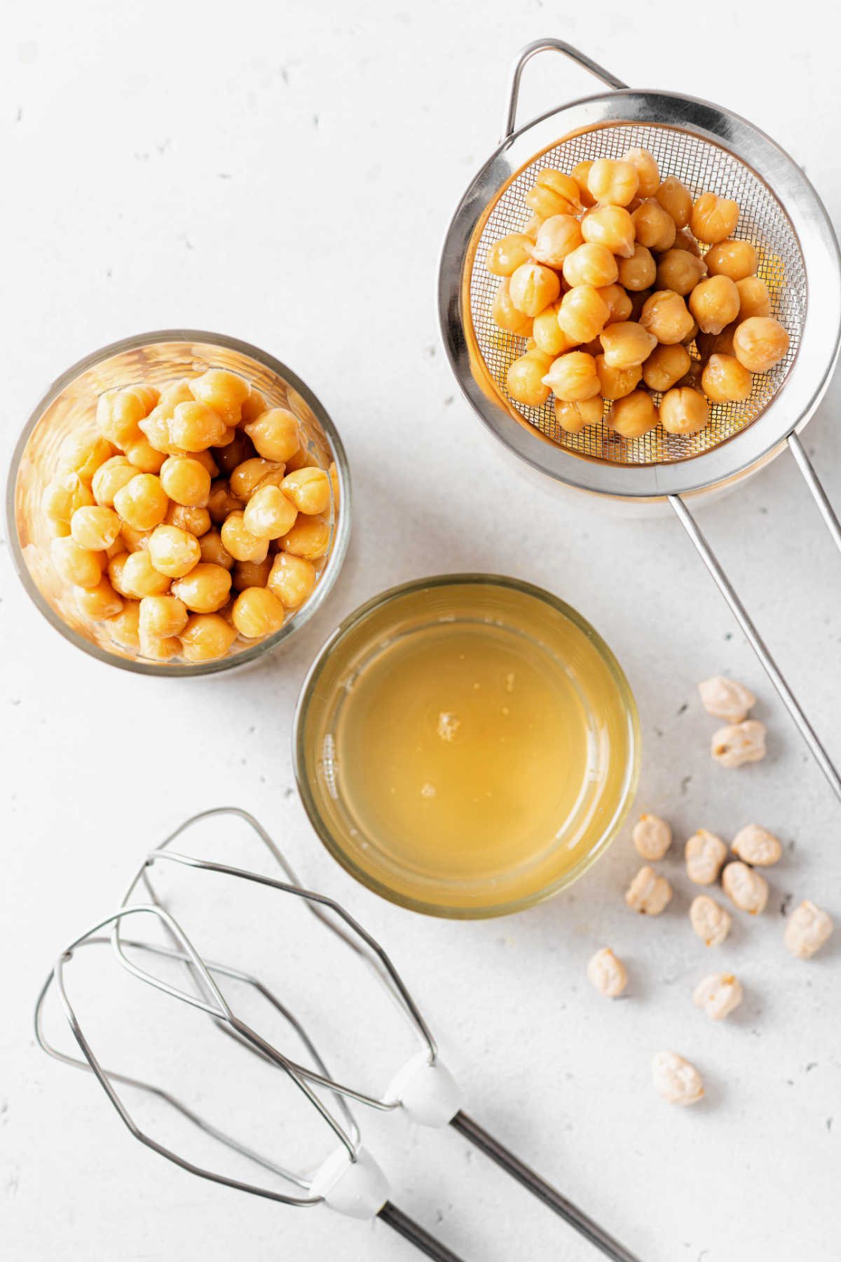 Aquafaba, dried chickpeas, cooked chickpeas and hand mixers