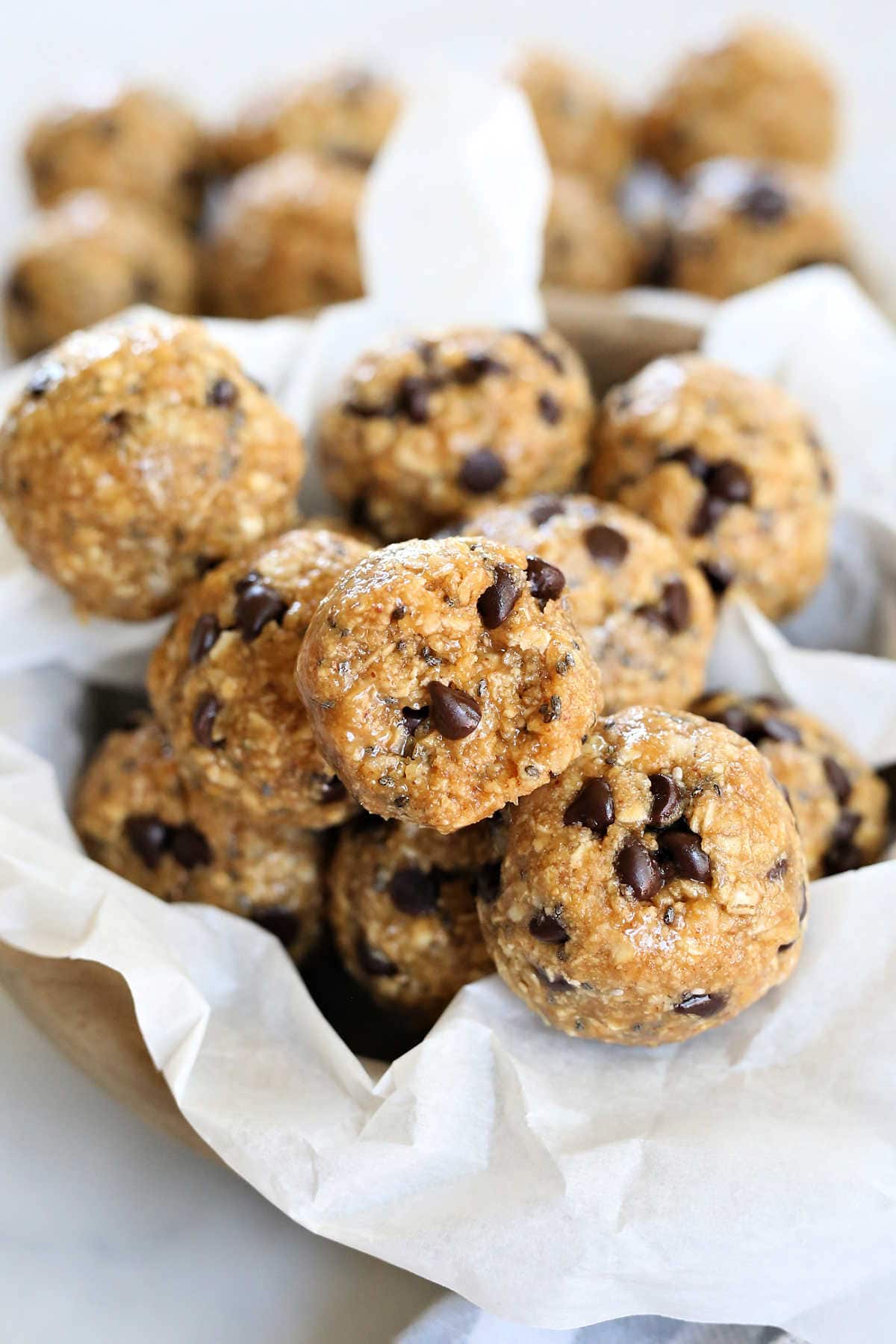 stack of balls of protein bites in parchment paper