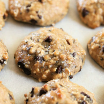 vegan peanut butter chocolate chip protein cookies close up on a baking sheet pan