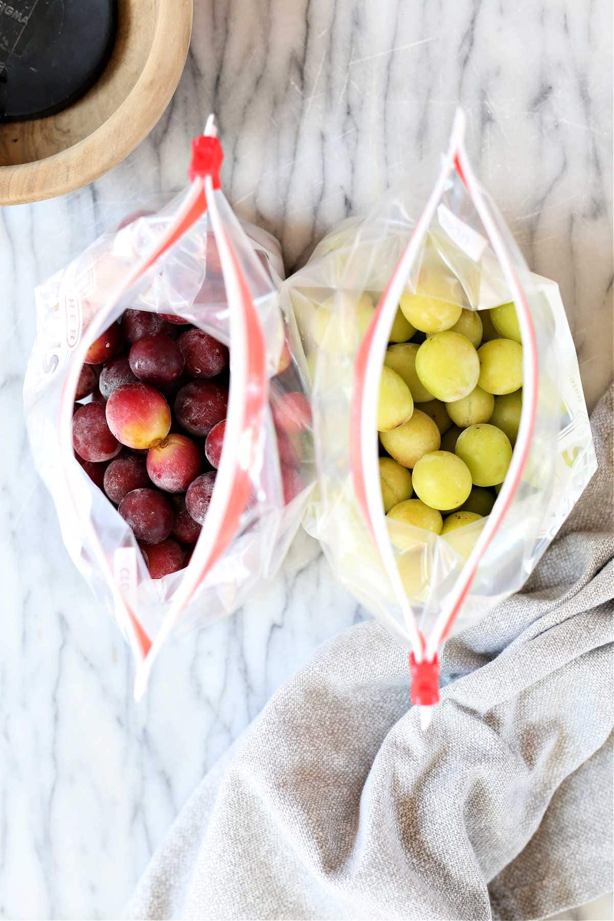 red grapes and green grapes frozen and stored in freezer bags
