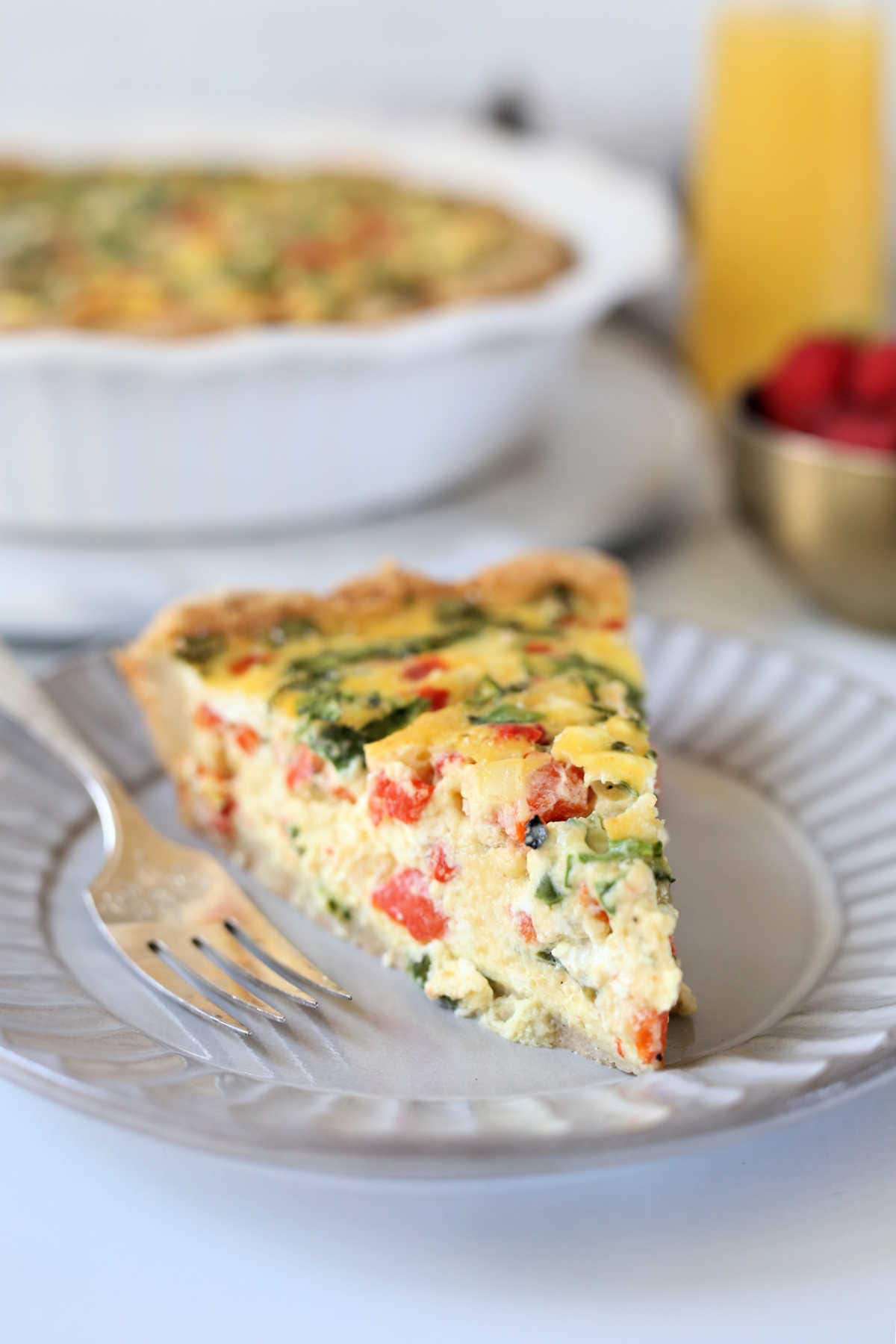 slice of healthy quiche on a plate with a fork