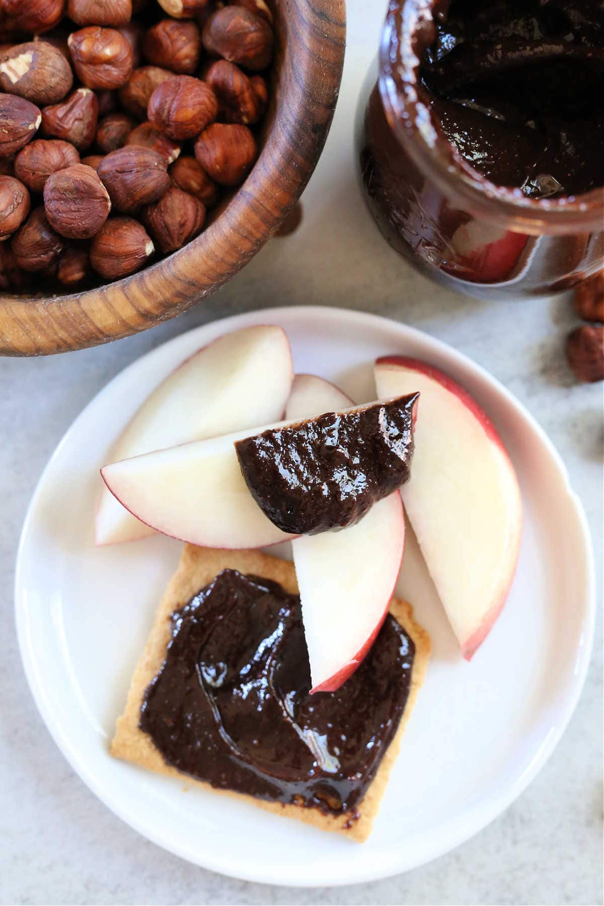 chocolate hazelnut spread on a graham cracker and fruit