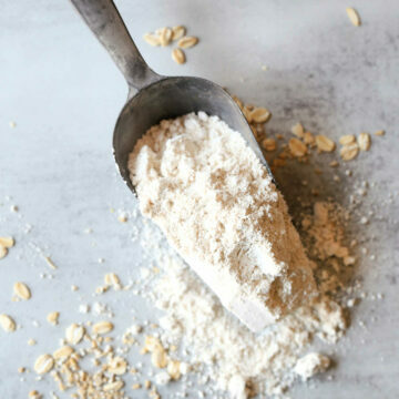 homemade oat flour on a flour scooping spoon