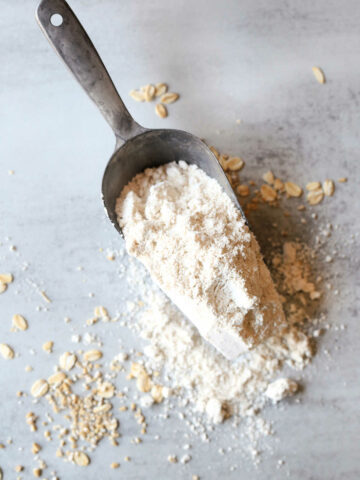 homemade oat flour on a flour scooping spoon