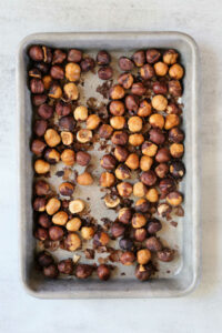 roasted hazelnuts on a sheet pan