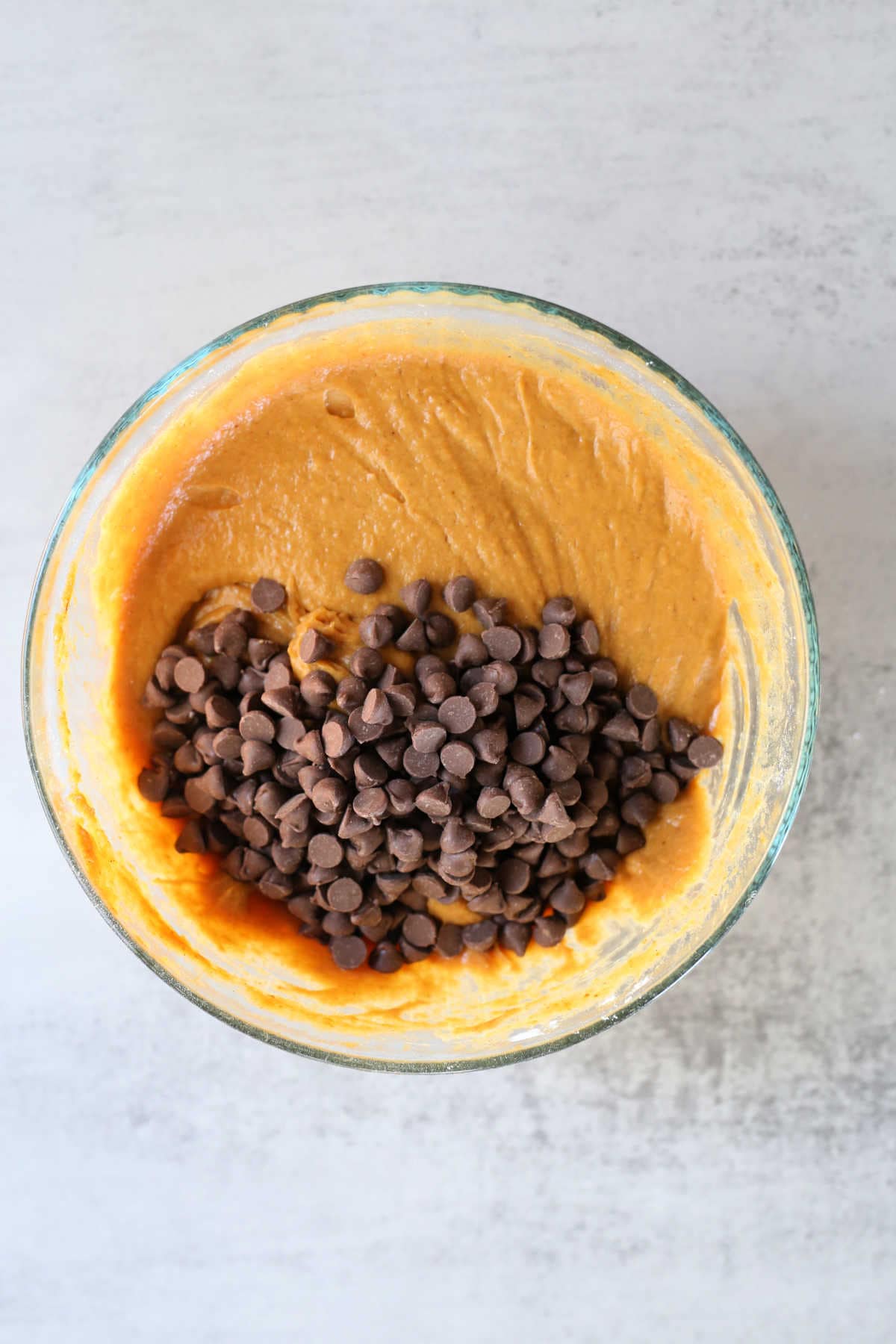 pumpkin chocolate chip muffin batter in a bowl
