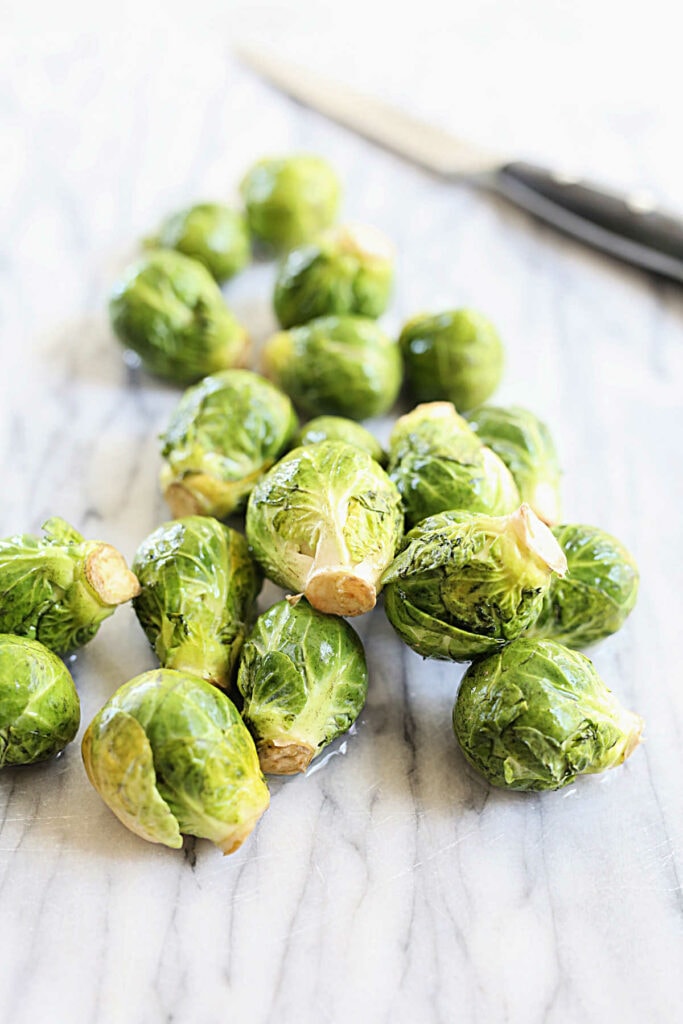 fresh brussels sprouts on a cutting board