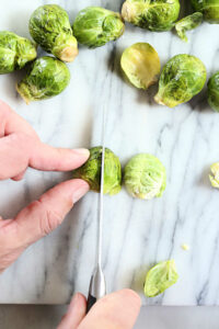 overhead view showing how to cut brussels sprouts into quarters
