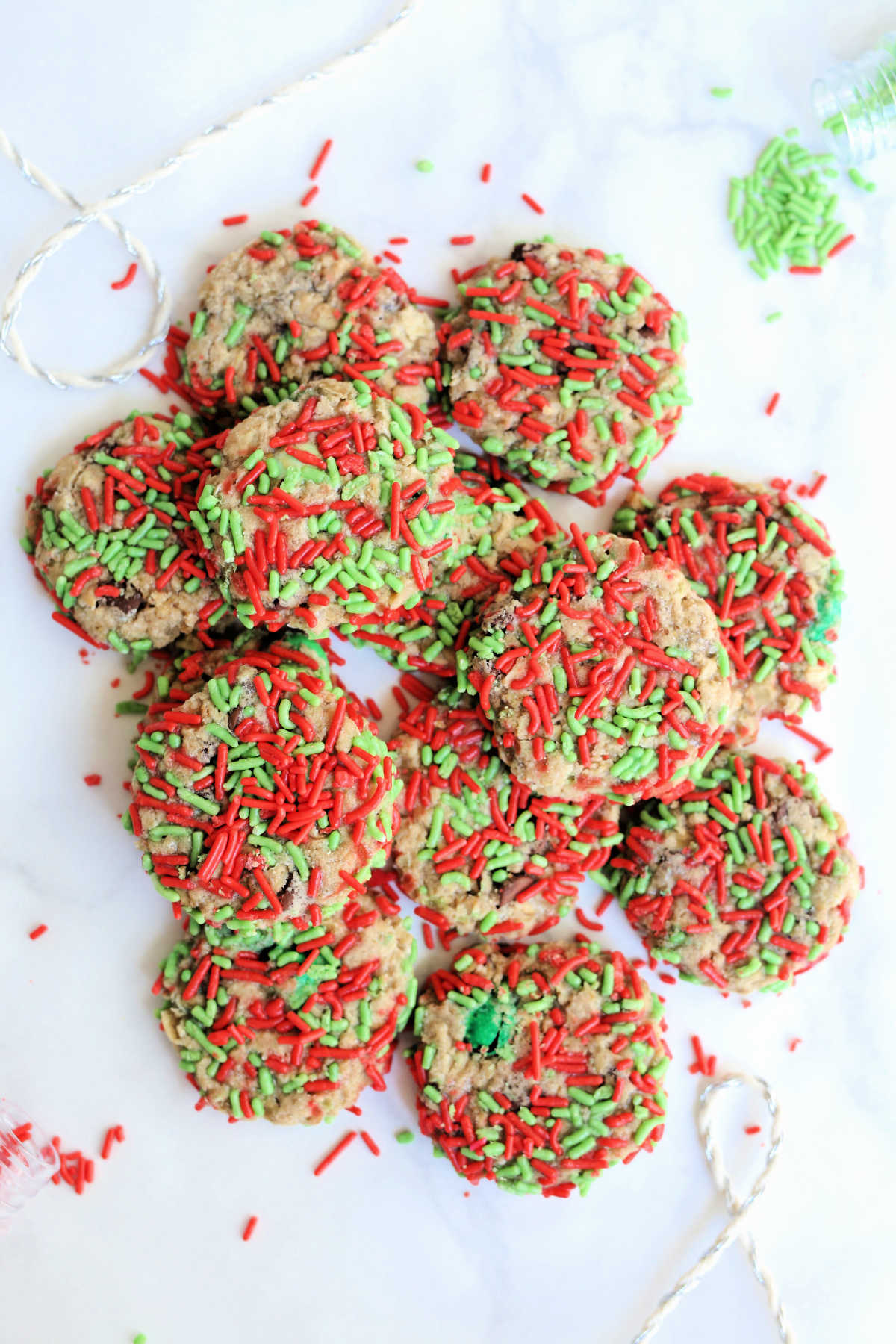 dozen healthy gluten-free Christmas cookies covered in red and green sprinkles