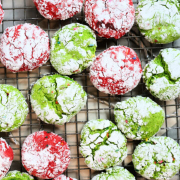 red and green crinkle cookies on a cooling rack for Christmas