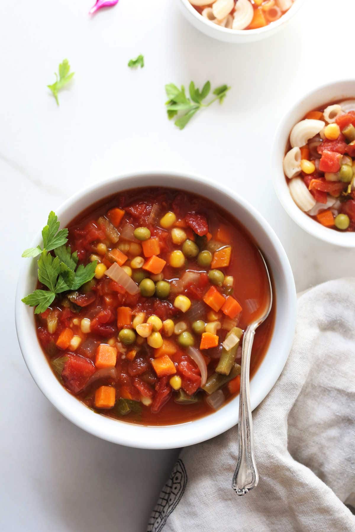 easy vegetarian soup made of frozen vegetables in a bowl with a spoon