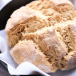 Gluten-Free Soda Bread Made Without Buttermilk On Parchment Paper in a Iron Skillet