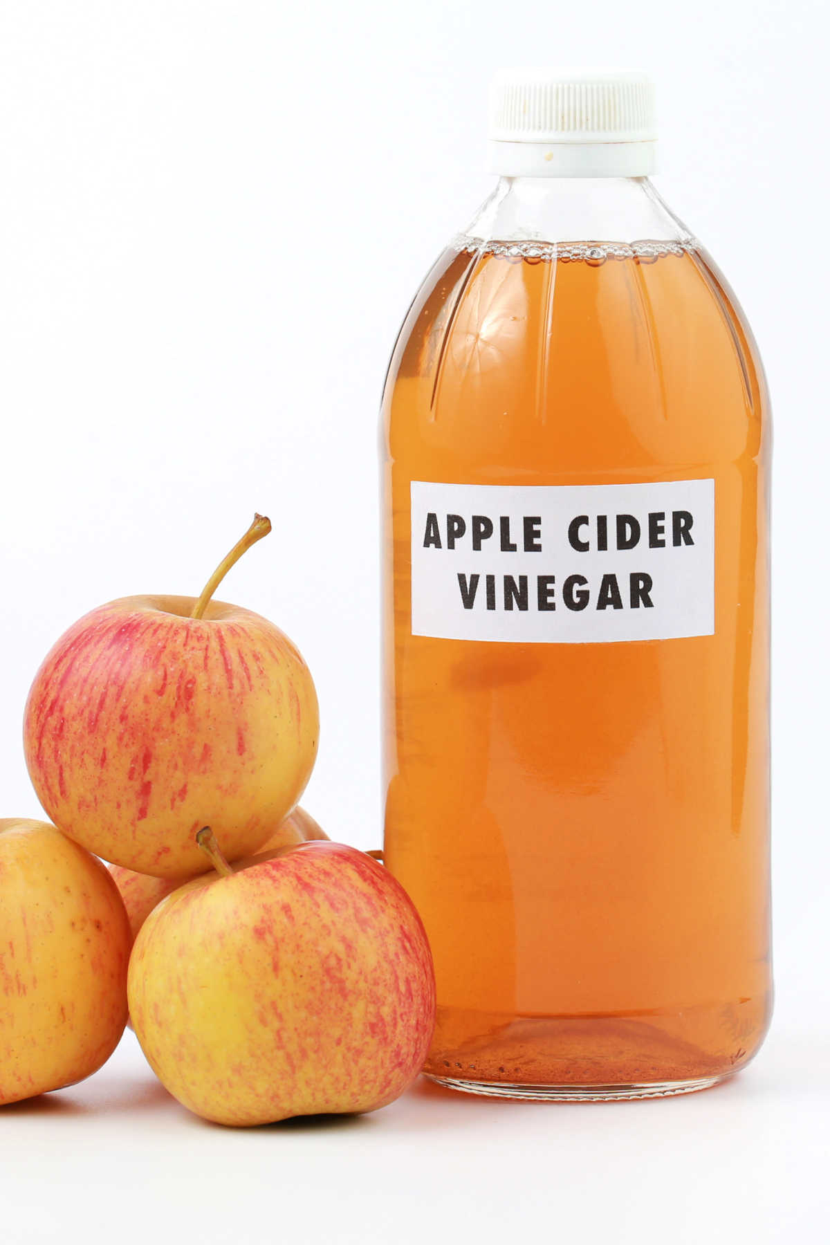 Bottle of Apple Cider Vinegar and Apples