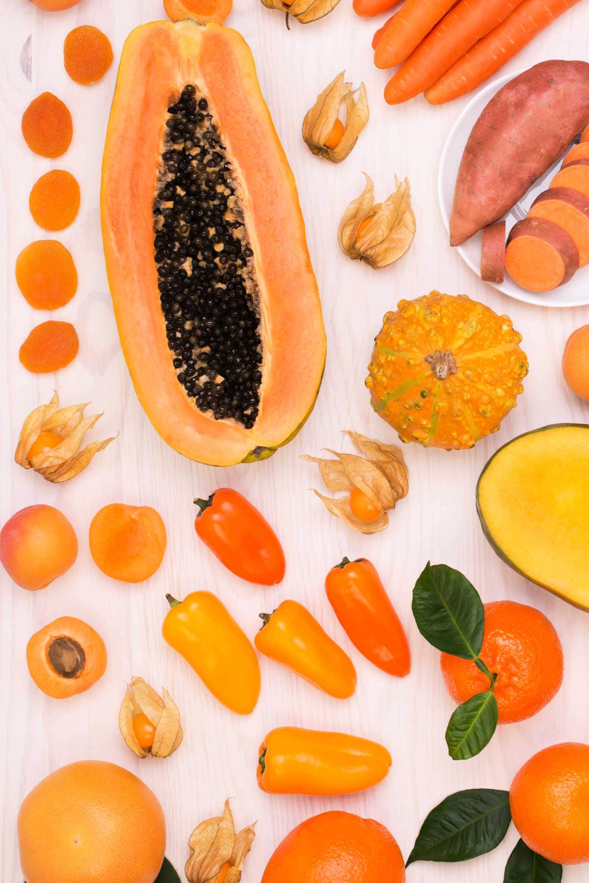 Orange Fruits and Orange Color Produce on a White Background