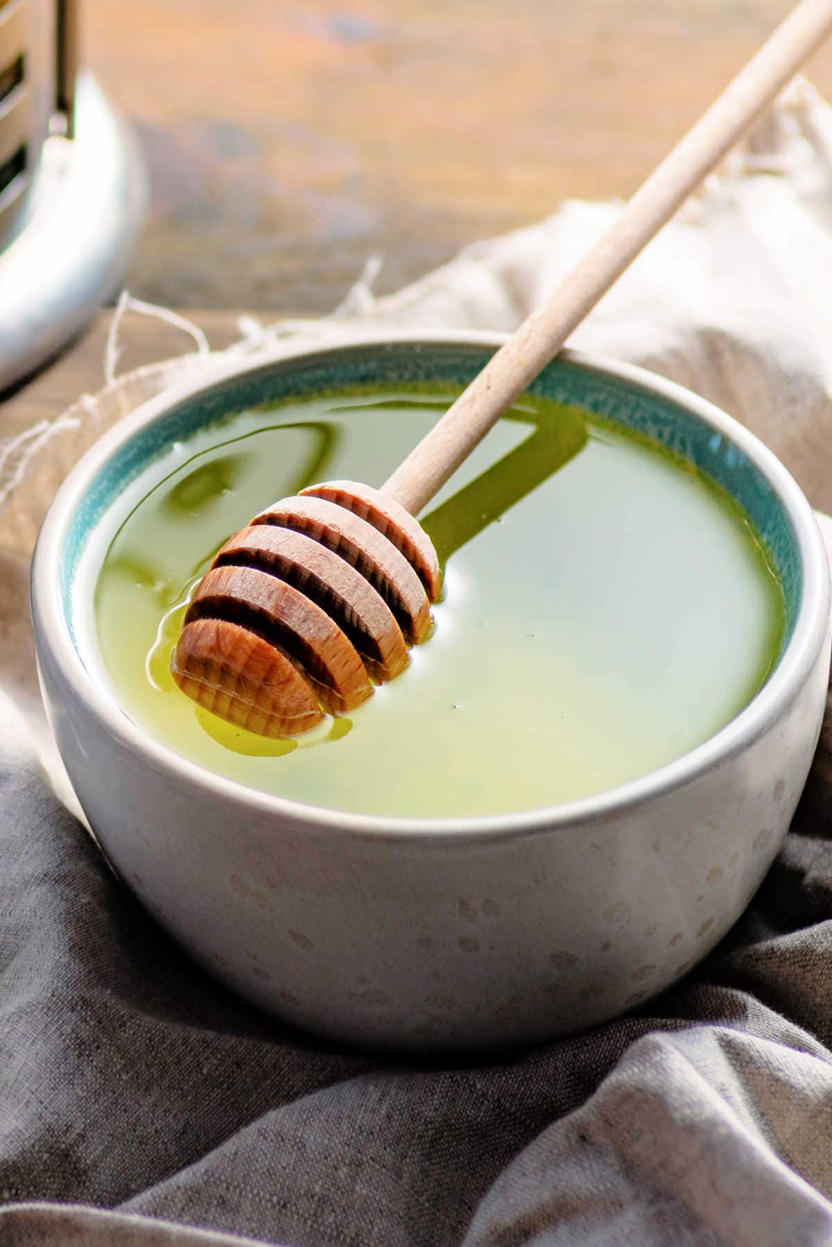 Green Tea with Honey Stick in a Mug