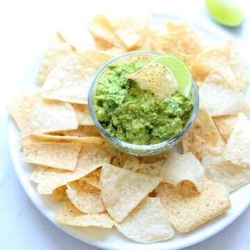 Easy recipe for guacamole in a salsa bowl with chips.