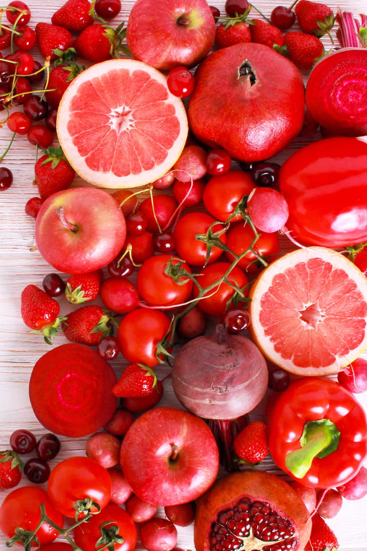 Red Fruits and Vegetables on A Wood Background
