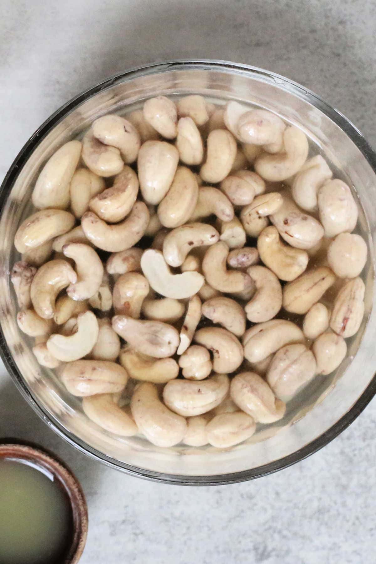 Unsalted Raw Cashew Nuts Soaking in Water