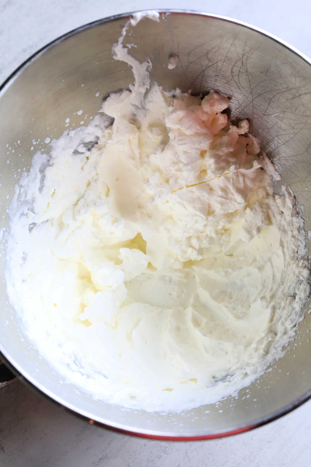 Overview of Sugar-Free Keto Whipped Cream Topping in an Electric Mixer Bowl.